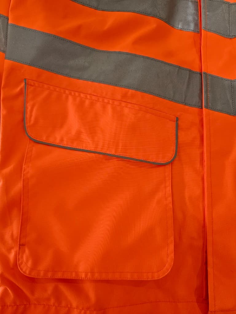 Hi-vis jacket with reflective bands and reinforced patch pocket