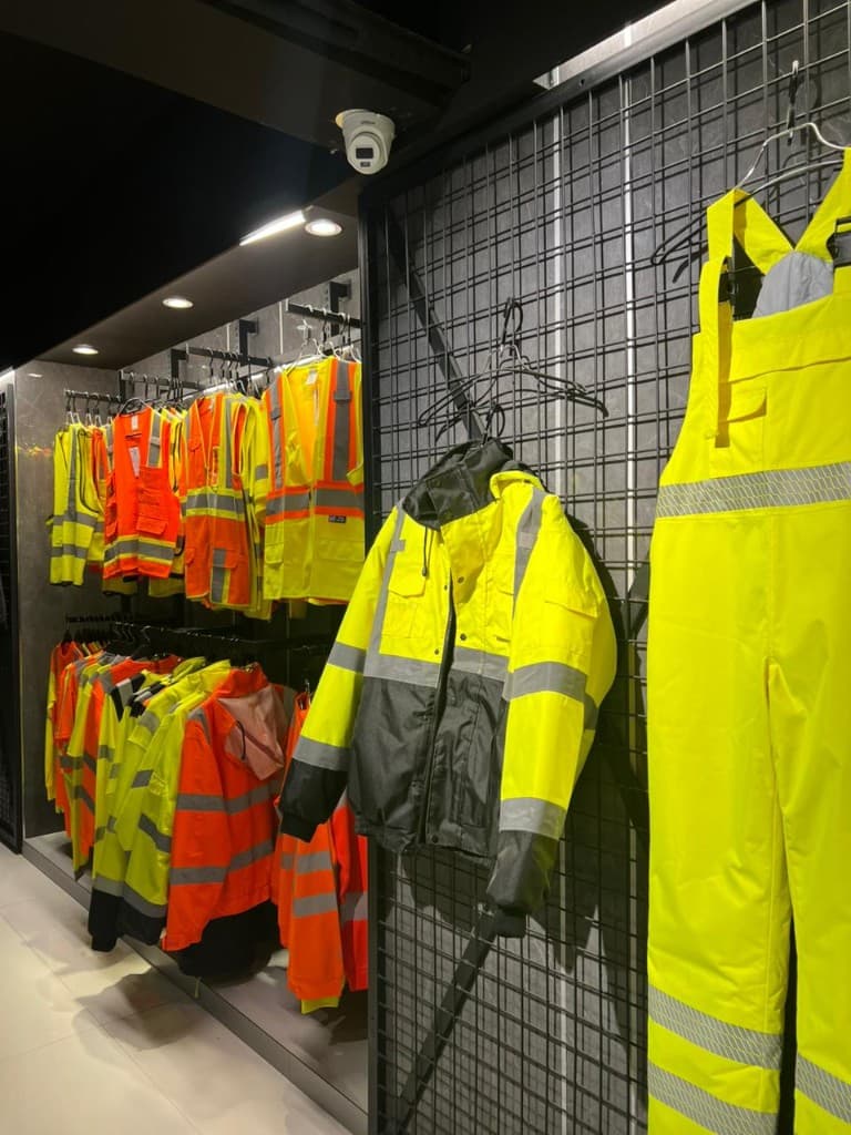 Hi-vis workwear stored on industrial rack systems in warehouse