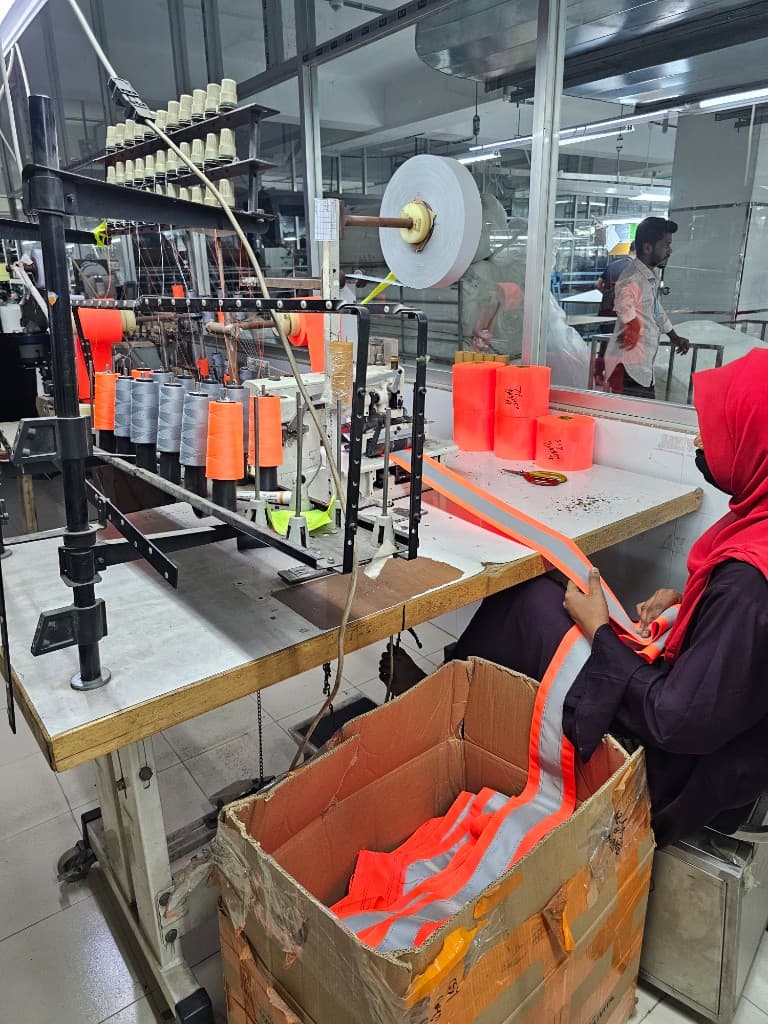 Reflective tape application on hi-vis garment production line