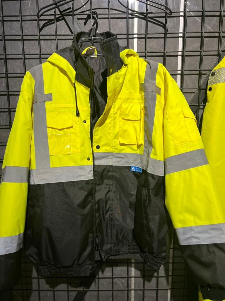 Hi-vis jacket reflective tape and pocket construction detail