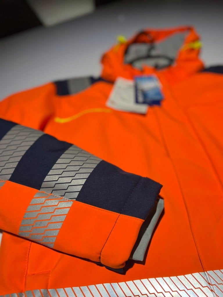 Hi-vis padded jacket sleeve with reflective tape — outerwear production