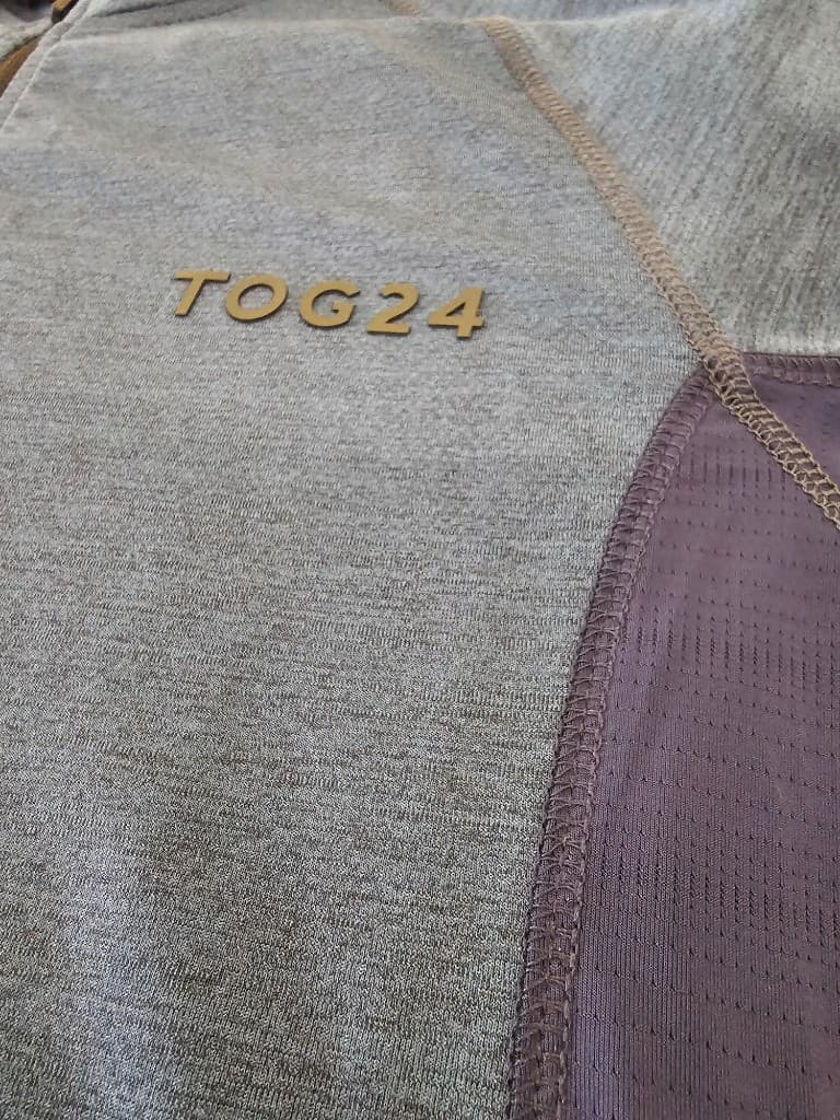 Flatlock panel construction on technical knit workwear garment